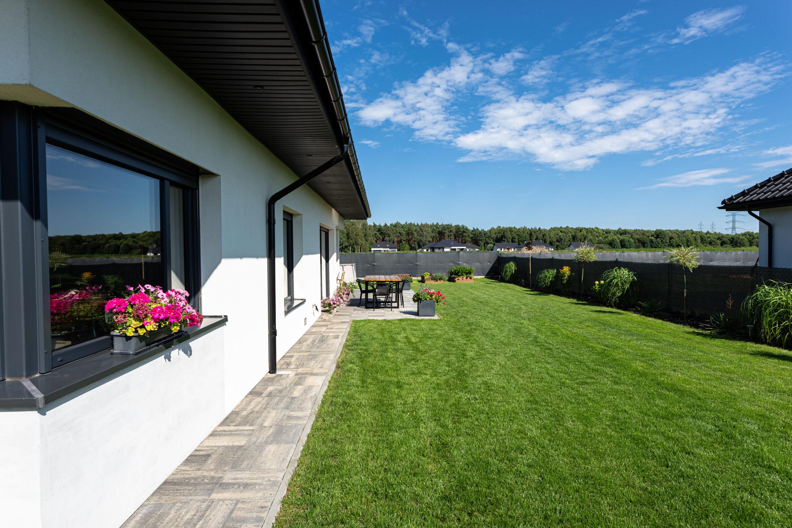 Beautiful Garden With Green Grass Visible Terrace