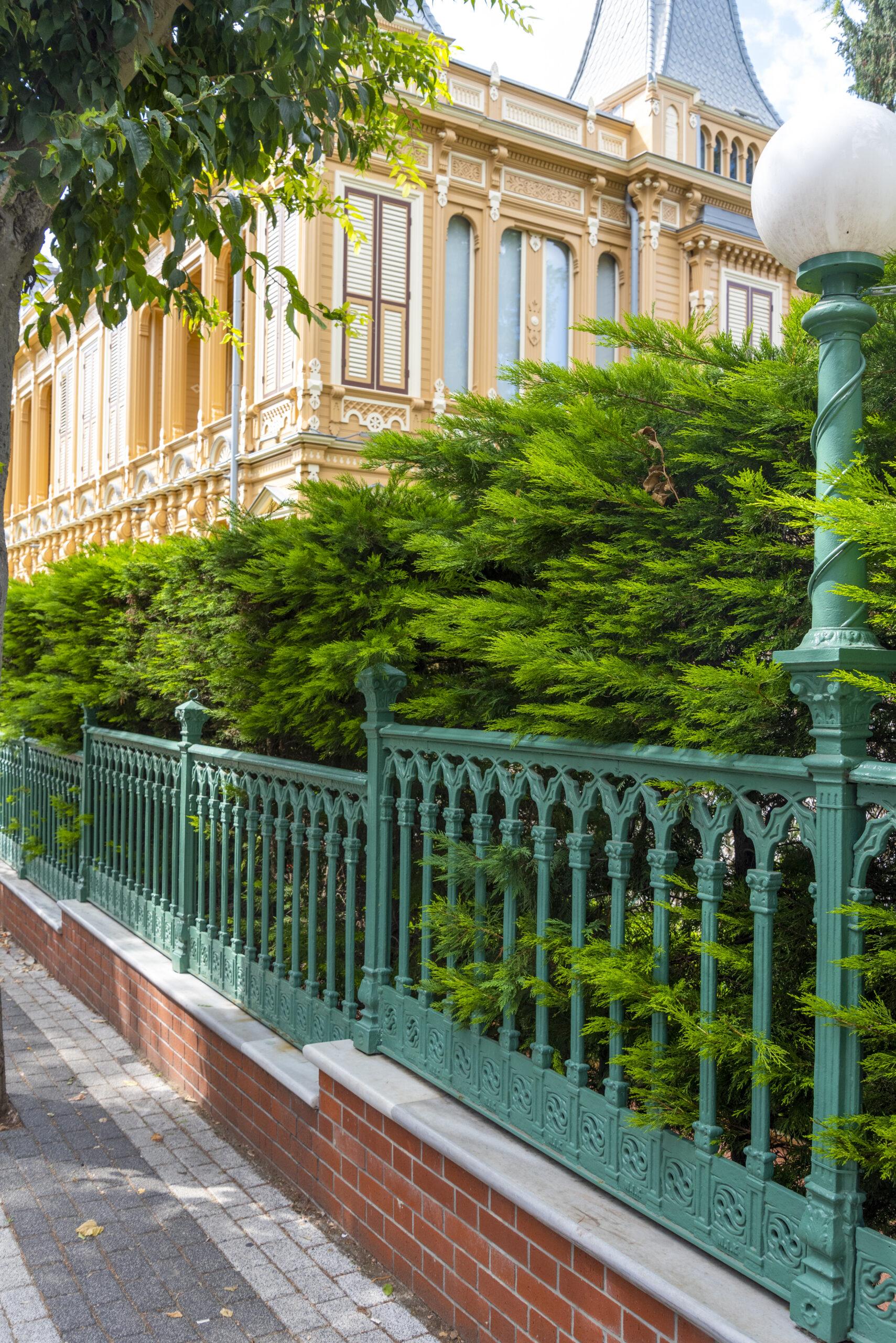 Beautiful Green Fence Lines Pathway Beside Histori