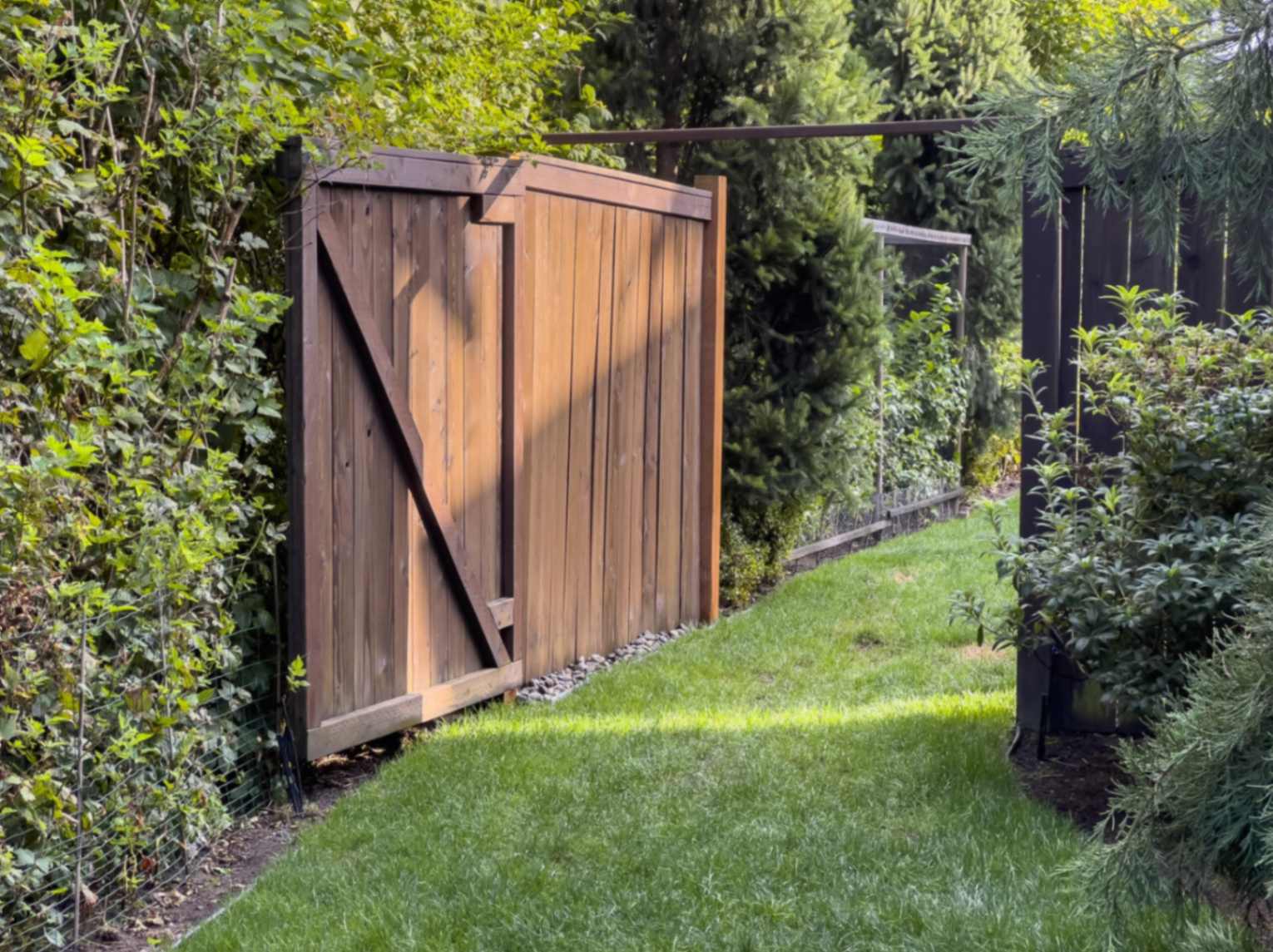 Beautiful View Of An Open Wooden Gate Leading Into