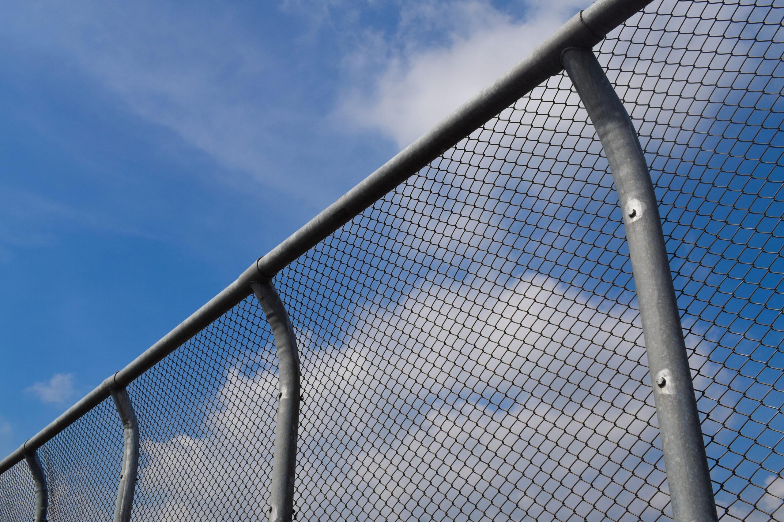 Chain Link Fence On Blue Sky