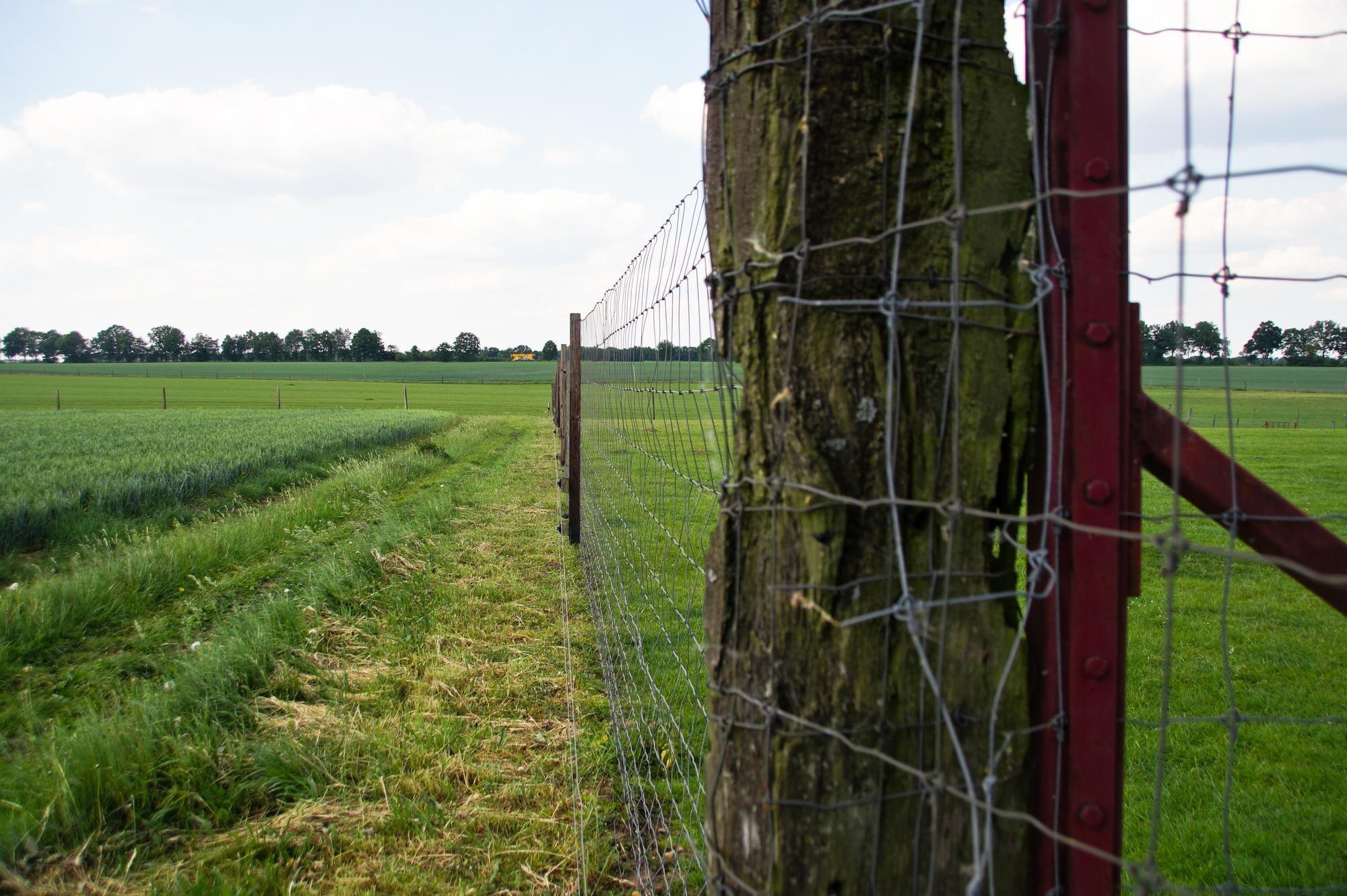 Fence On Field Against Sky