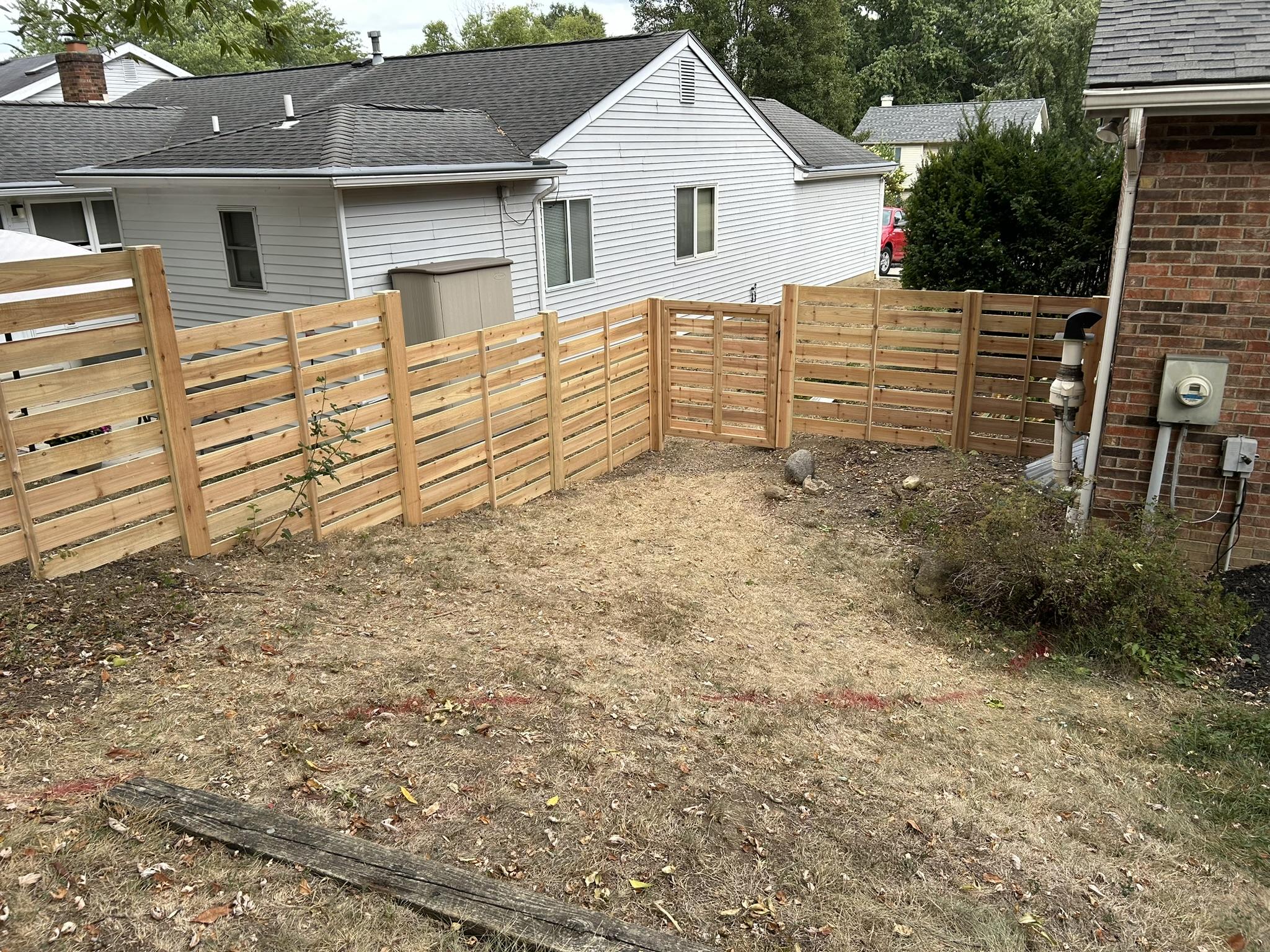 Fencing a Sloped or Uneven Yard: What Columbus Property Owners Should Know