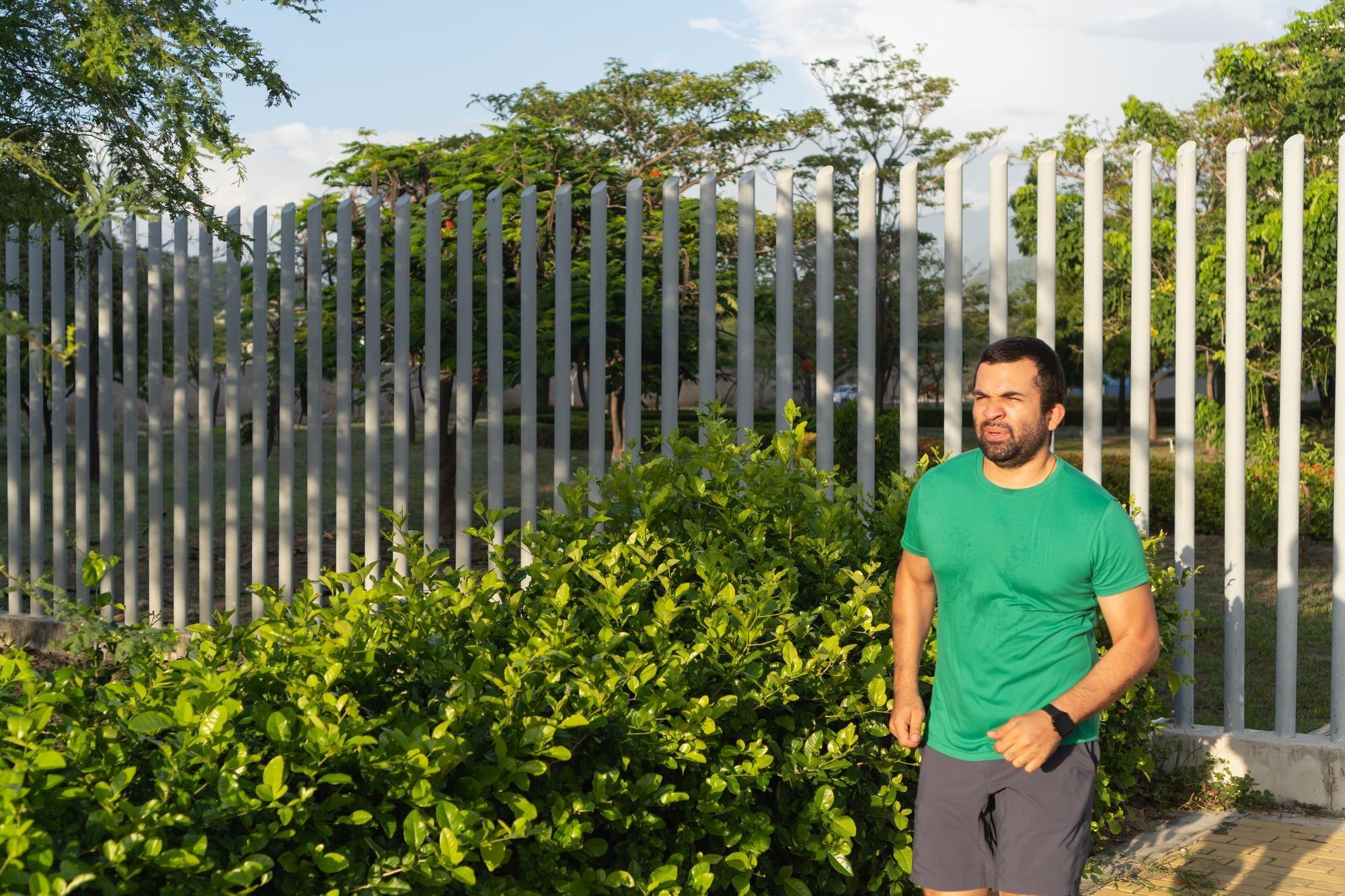 Man Jogging In Park For Weight Loss And Healthy Li
