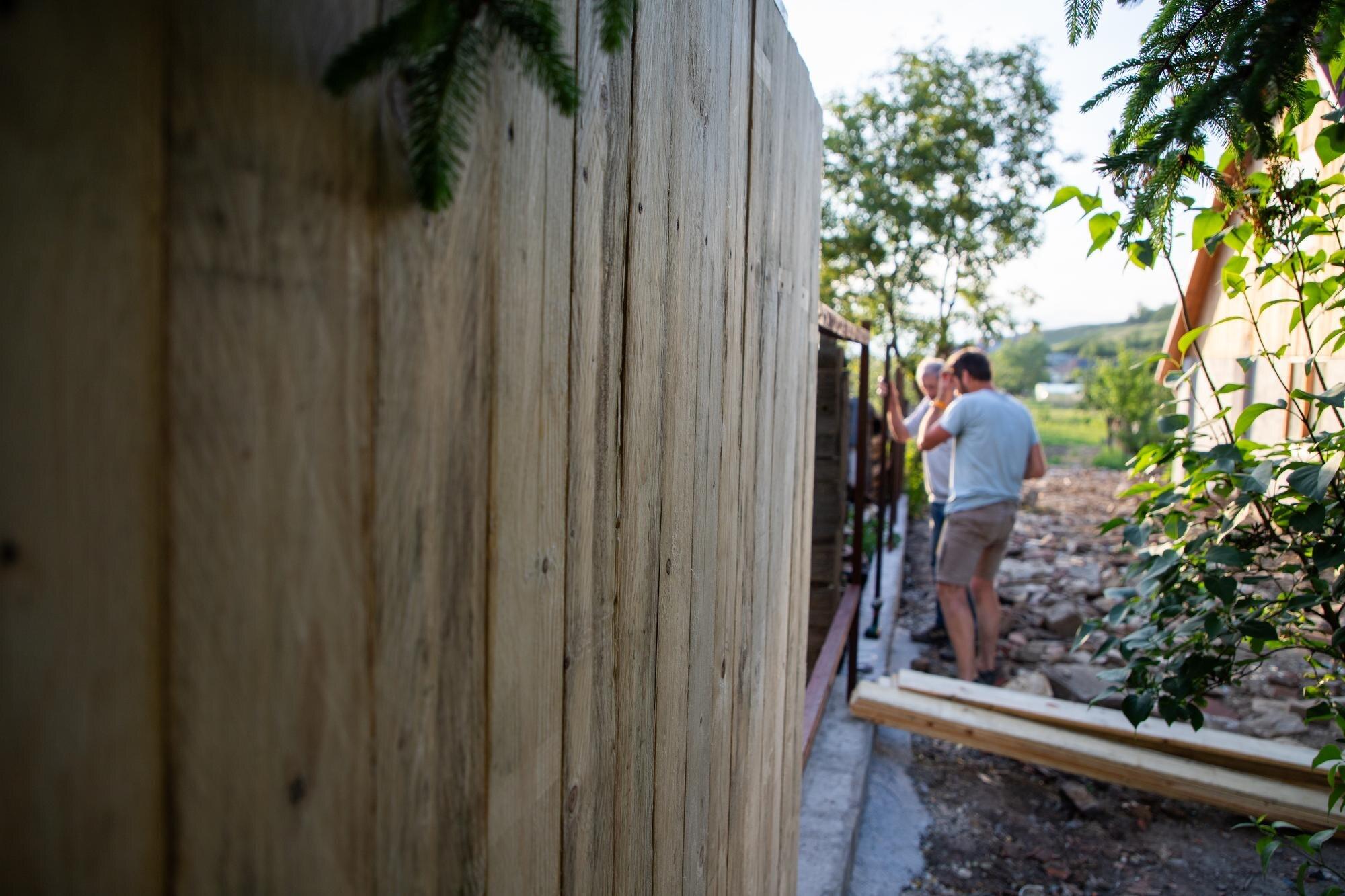 Man Making A Wooden Fence
