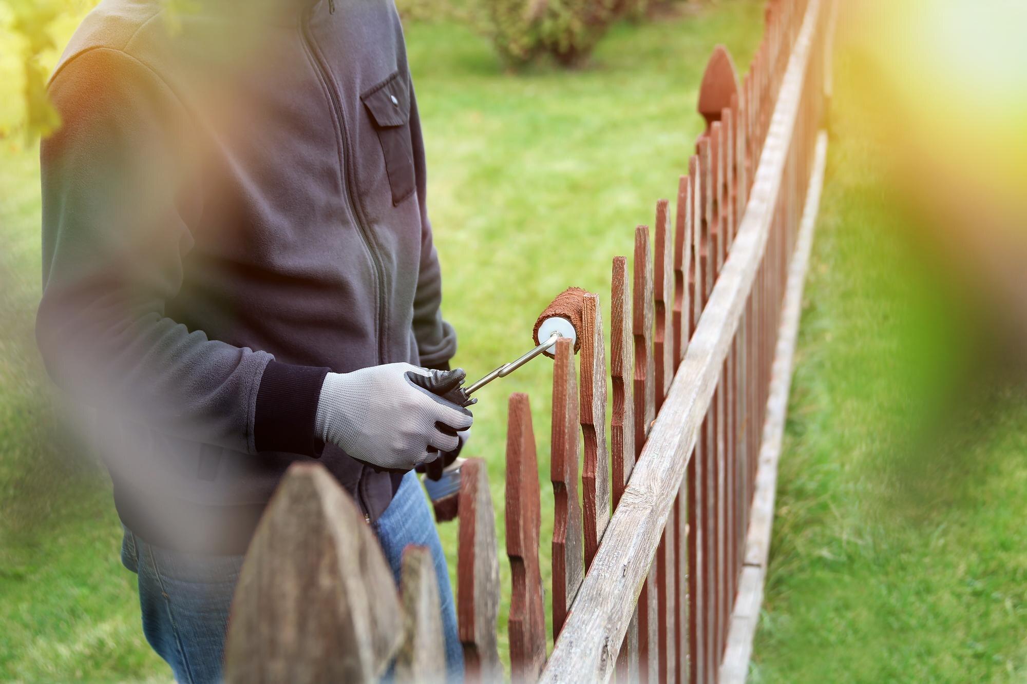 Painting Wooden Fence With Brown Paint Outside