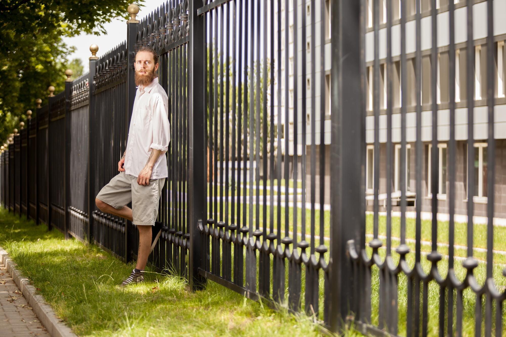 Rear View Of Young Man Standing In City