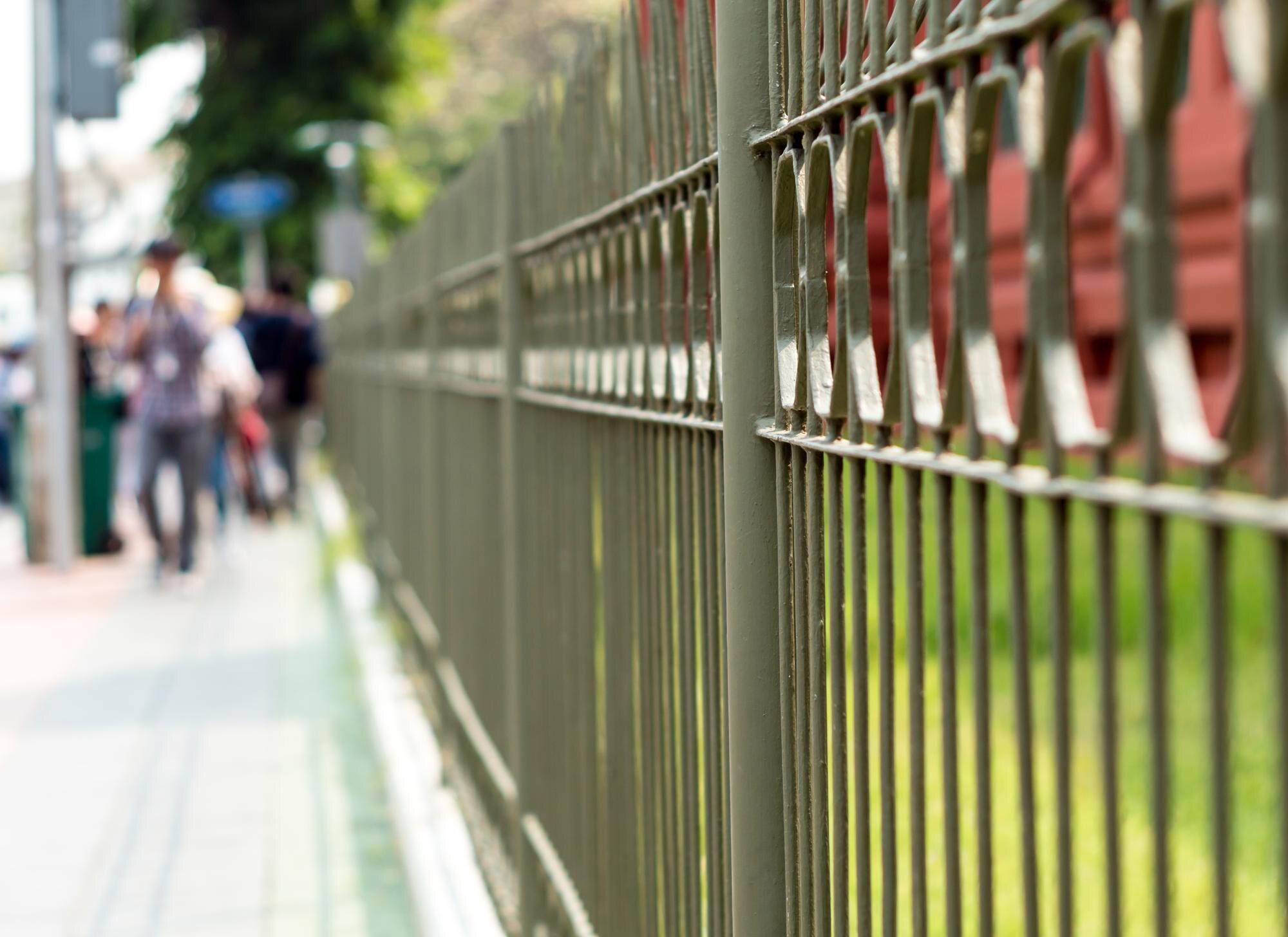 Wrought Iron Fence Beside A Street In The City